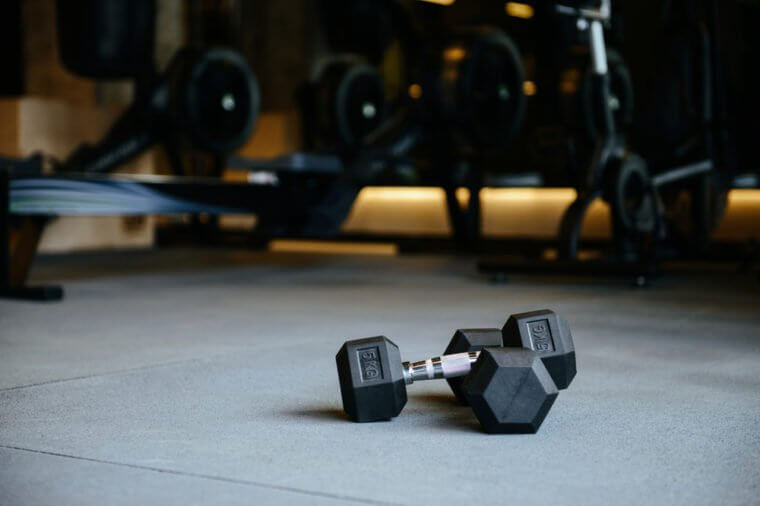 Photo of dumbbells which lying on the floor in gym